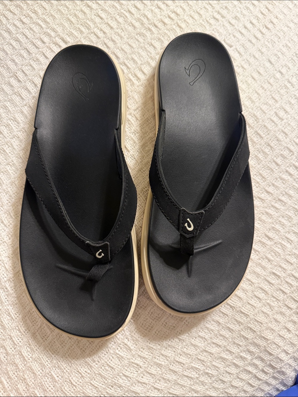 OluKai Black Flip Flops with Cream Trim